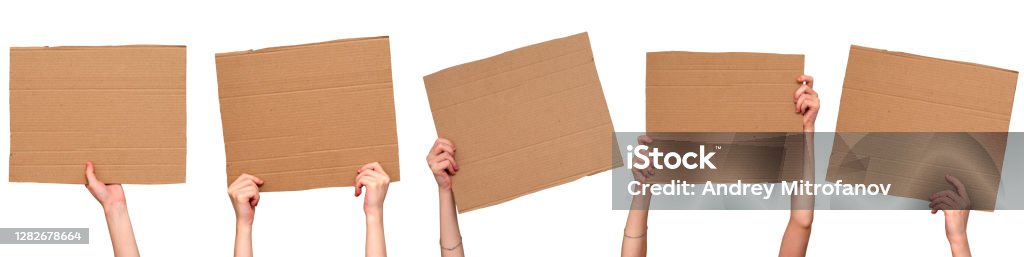 Posters of cardboard in his hands. Isolated on white. Set. Copy space. Posters of cardboard in his hands. Isolated on white. Set. Copy space Protest Stock Photo