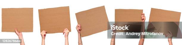 Posters Of Cardboard In His Hands Isolated On White Set Copy Space Stock Photo - Download Image Now