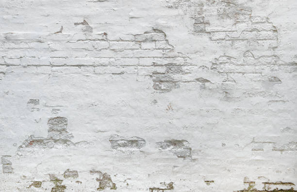 White brick wall background Weathered plaster stock photo