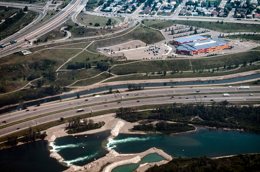 Photograph taken from an airplane of the ice hockey arena and events centre in the  western Canadian city and suburbs of Calgary.