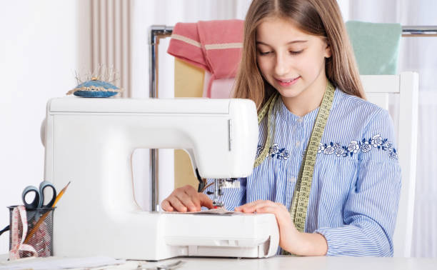 istock Girl working as a tailor 1282682135