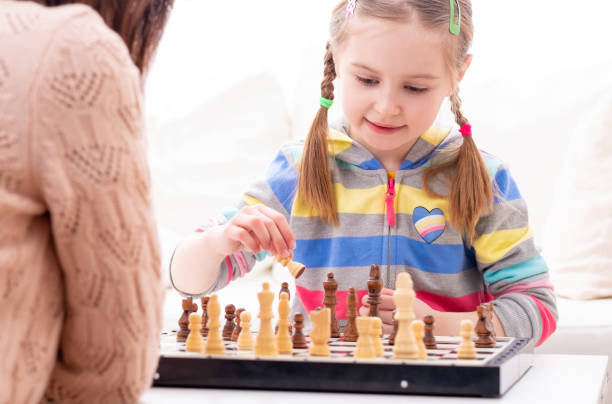 istock Mother is plating the chess game with her daughter 1282682275