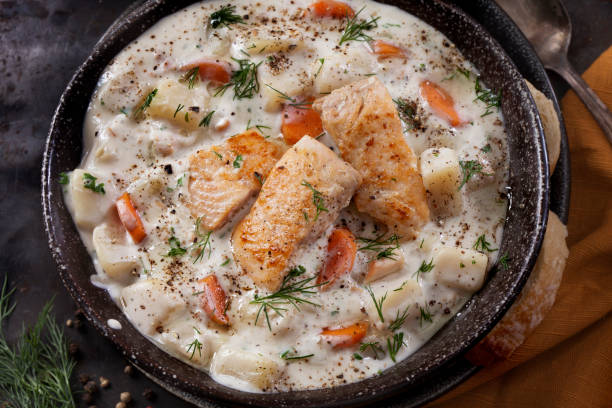 Butter Poached Salmon Chowder with Potatoes, Carrots and Fresh Dill Butter Poached Salmon Chowder with Potatoes, Carrots and Fresh Dill Chowder stock pictures, royalty-free photos & images