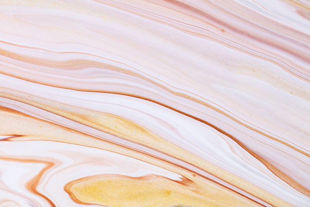 istock Fluid art texture. Backdrop with abstract iridescent paint effect. Liquid acrylic artwork with flows and splashes. Mixed paints for website background. Golden, brown and beige overflowing colors. 1282687497