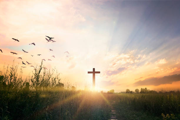 istock Good Friday concept: cross on sunset sky background 1282688681