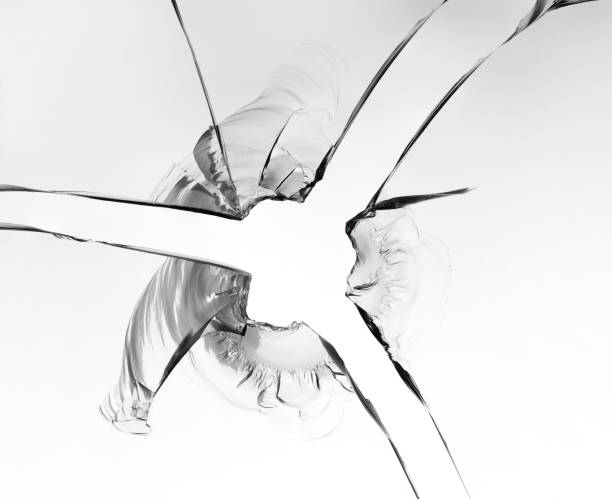 istock Texture of broken glass, macro photo on white background. 1282690592