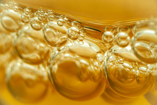 Close-up bubbles on the surface of kombucha vinegar stock photo