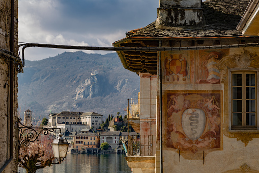 Park Cioni and  view on lake Lugano in sunny day of winter - topiary bushes (maybe of boxwood)