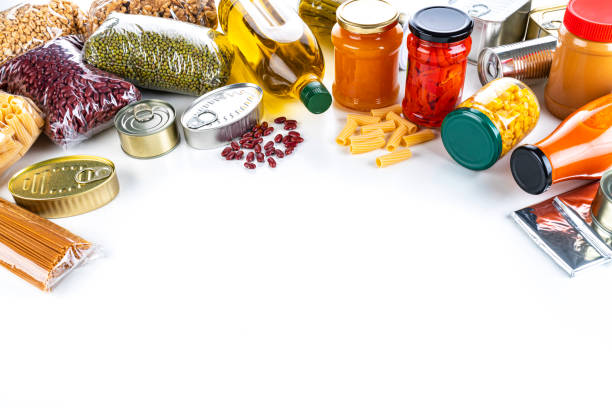 istock Non-perishable food frame: canned goods, conserves, sauces and oils. Copy space. 1282694799
