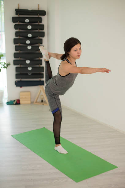 istock Young woman practicing yoga 1282697581