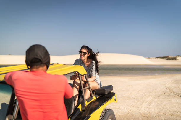istock People taking a ride in a buggy in sand dunes 1282700868