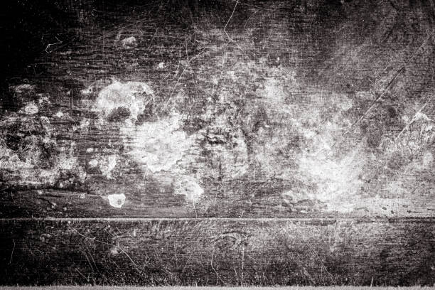 istock Scratched dirty dusty copper plate texture, black and white image. 1282701959