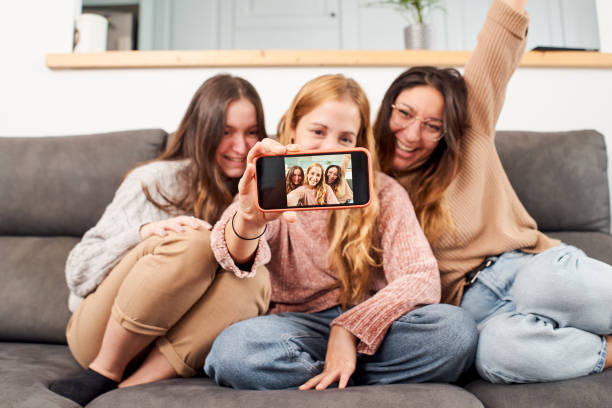 istock Female friends at home taking a selfie. 1282702388