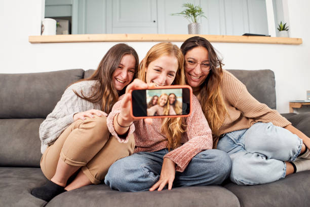 istock Female friends at home taking a selfie. 1282702505