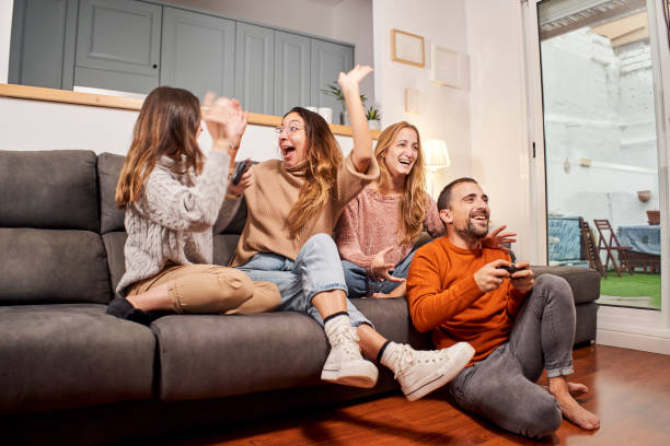 istock Group of friends playing video games. 1282703085