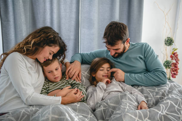 istock Happy sleepy family. 1282703394