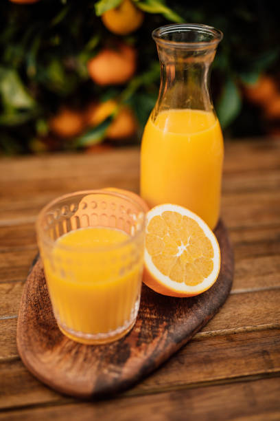 istock Appetizing freshly orange juice from organic oranges from the own tree 1282705794
