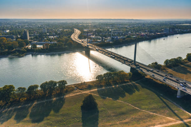 traffic on modern bridge over Rhine river at late sunny afternoon