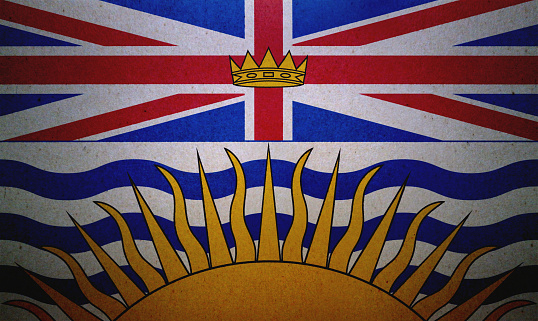 Flag of British Columbia (Canada) printed on a paper sheet.