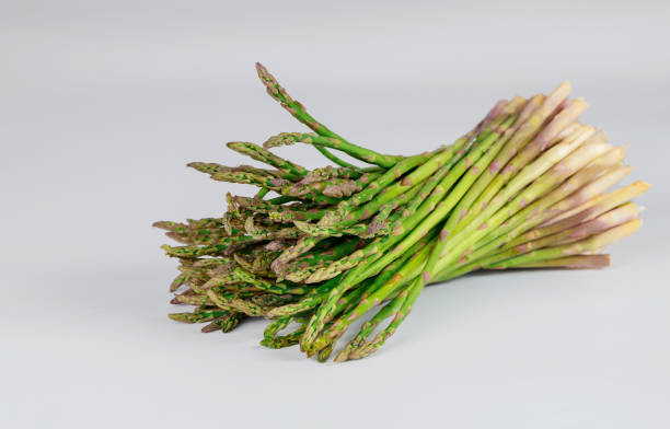 istock Heap of geeen asparagus on a white background. 1282708715