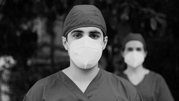 istock Healthcare workers looking at the camera wearing protective n95 masks 1282710172