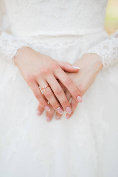 istock graceful hands of the bride with wedding ring on the finger 1282710179