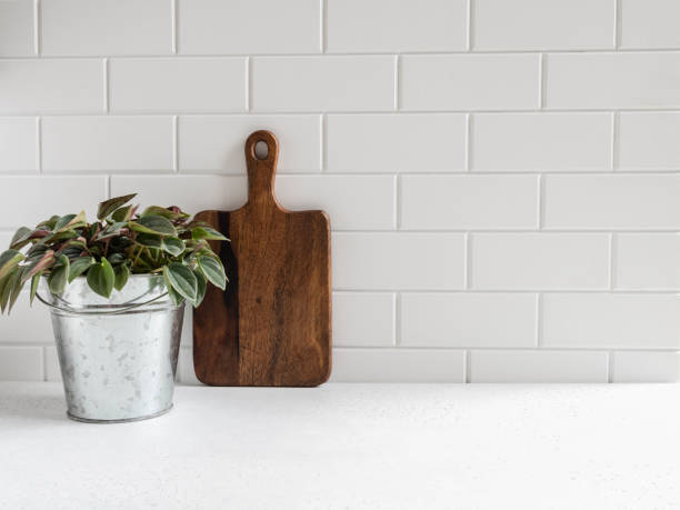 istock kitchen background with cutting board and houseplant 1282711110