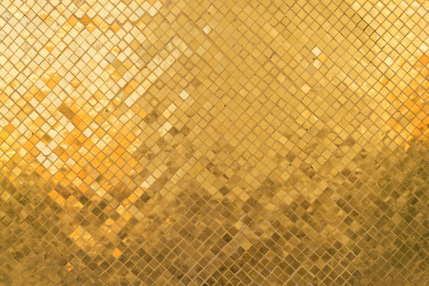 istock Golden or gold art grid square mosaic tiles wall pattern surface texture. Close-up of architecture interior shinny material for design decoration background. Thai style 1282711185