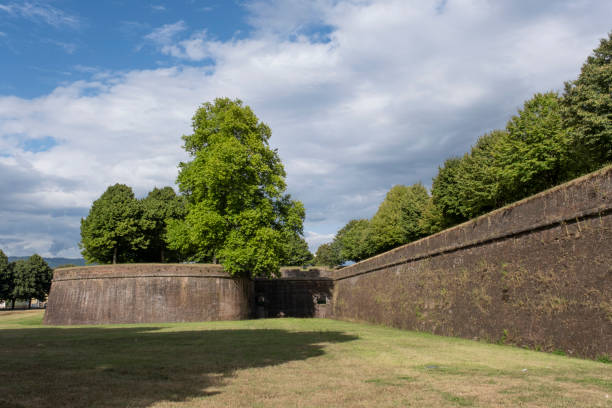 istock Grass in front of the fortress wall in Lucca. 1282711631