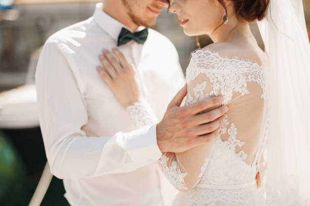 istock close-up bride and groom are hugging tenderly 1282712304