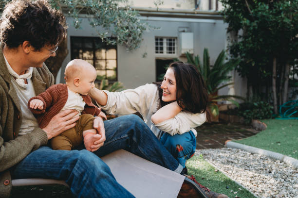 istock Family with one child having fun in the backyard 1282712478