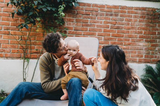 istock Family with one child having fun in the backyard 1282712484