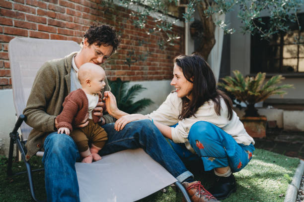 istock Family with one child having fun in the backyard 1282712487
