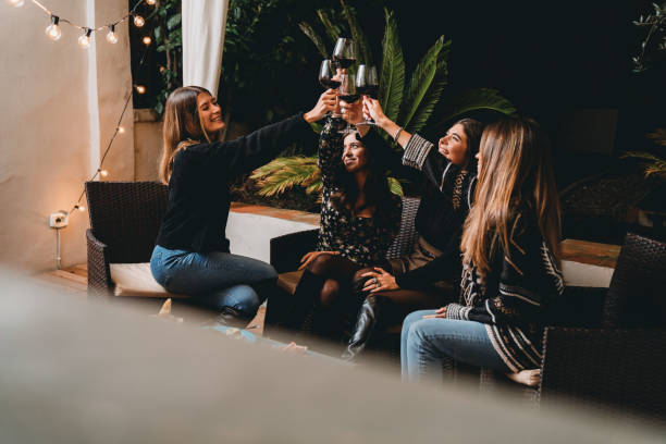 istock Friends toasting together with red wine during a patio dinner aperitif 1282712789