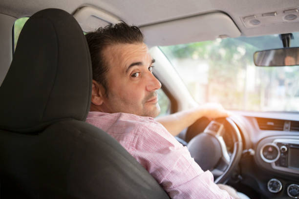 istock Man driving his car in the city 1282714480