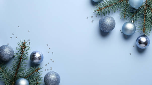 istock Blue Christmas background with pine tree branches decorated balls on blue background. Xmas frame border, banner mockup, greeting card template 1282715619