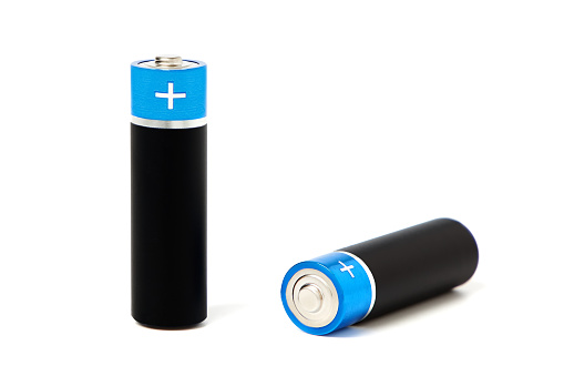 A closeup of two batteries or accumulator, isolated on a white background.