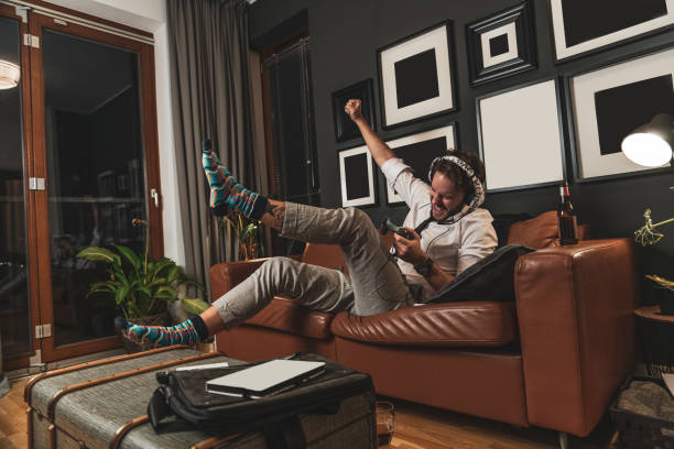 istock Man playing video games at home 1282717023
