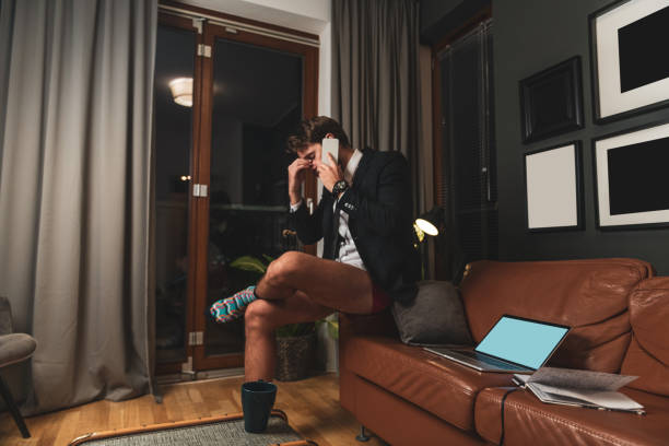 istock Young businessman working overtime from home 1282717116