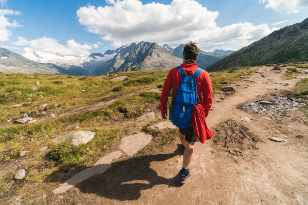 istock Young backpacker hiking a trail in the Alps mountains in Austria 1282719226