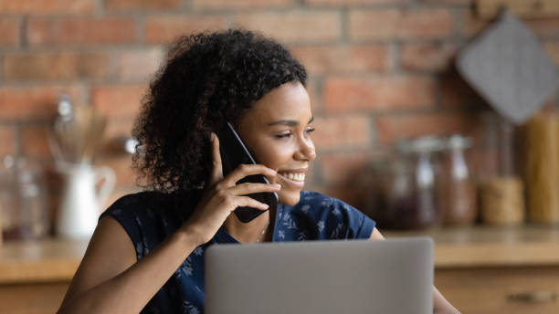 istock Smiling biracial woman use modern gadgets at home 1282721946