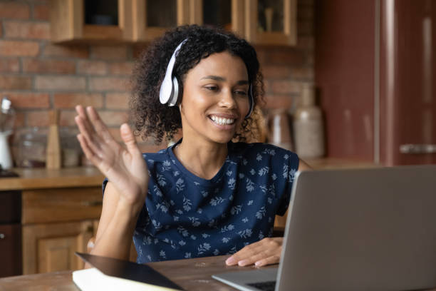 istock Smiling woman talk on video call on computer 1282721965