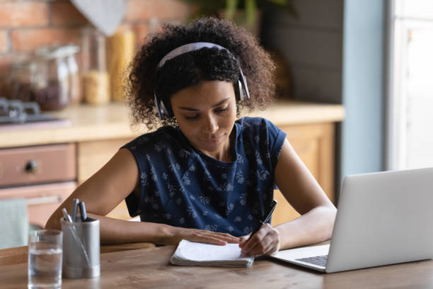 istock Millennial biracial girl study online on laptop 1282721972