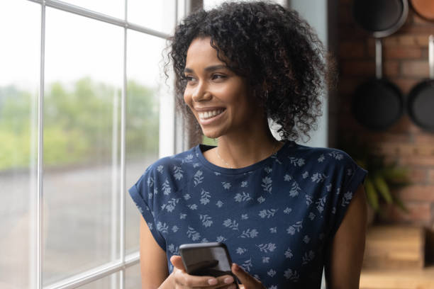 istock Happy African American woman look in distance visualizing 1282722010