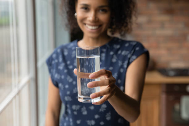 istock Smiling biracial woman recommend drinking clean water 1282722015