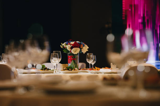 istock tableware Glasses, flower fork, knife served for dinner in restaurant with cozy interior 1282722075