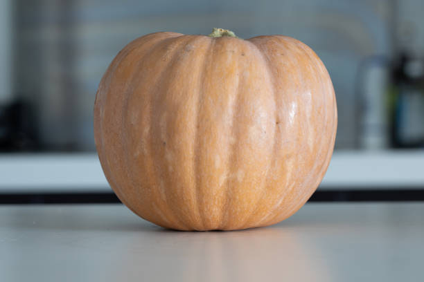 Fresh pumpkin on kitchen table. close up from a pumpkin in the kitchen
