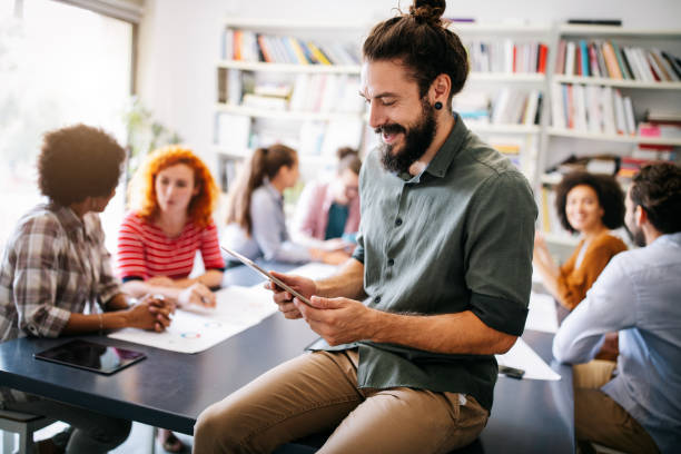 istock Group of business people collaborating on project in office 1282722488