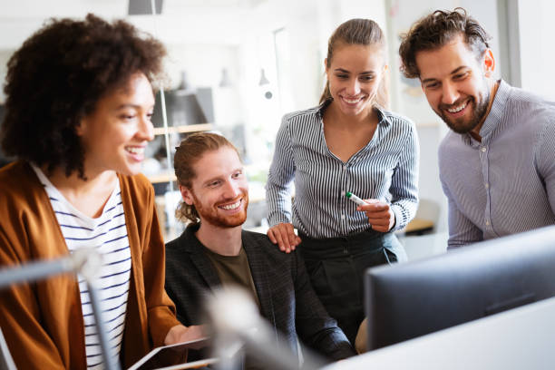 istock Group of business people collaborating on project in office 1282722631