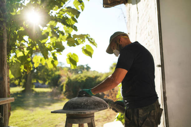 istock Manual craft worker rough polishing a ceramic sink with his power tool 1282723327